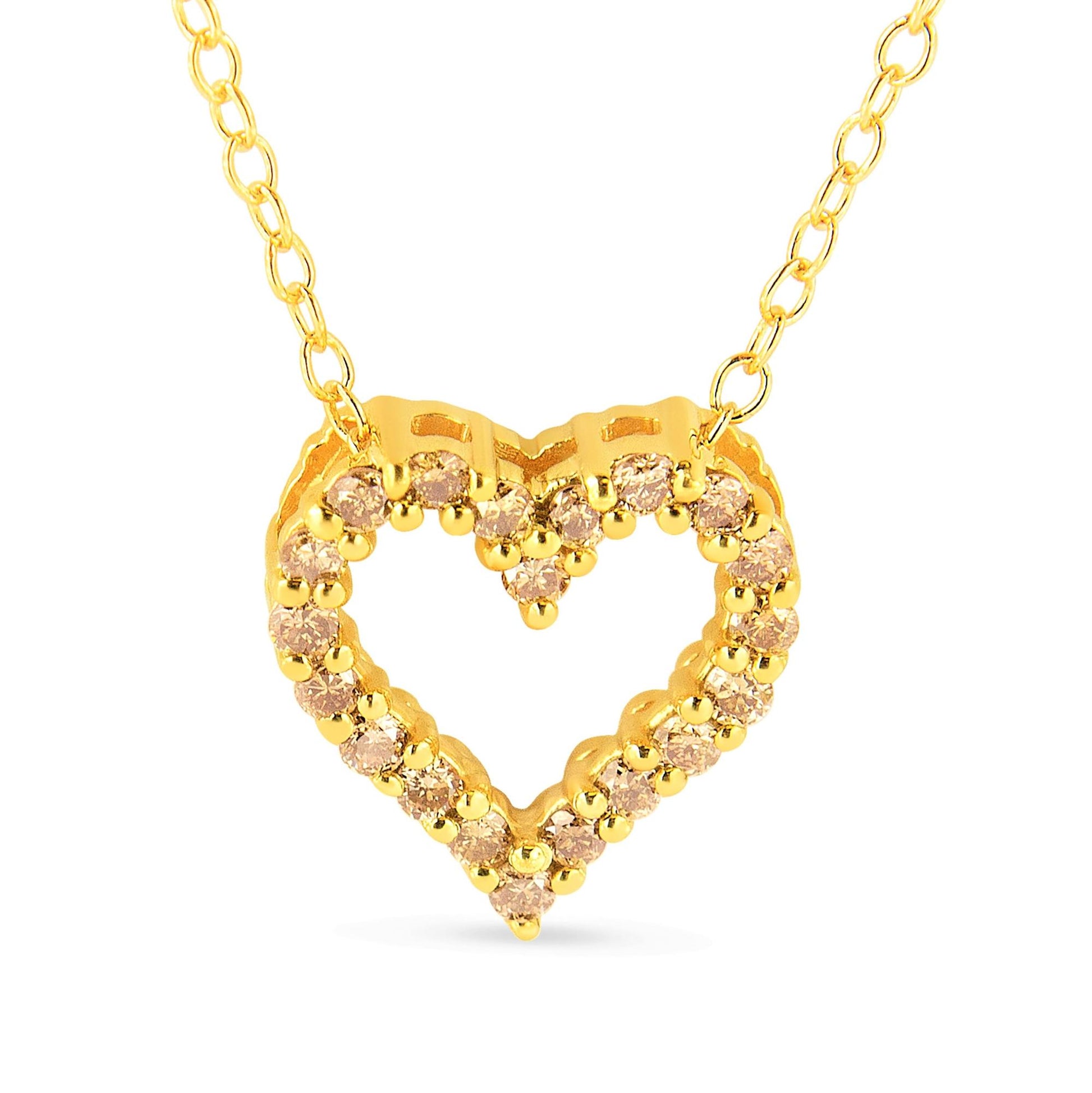 Front-facing shot of a yellow metal heart-shaped necklace pendant with round prong-set brownish gemstones along the outline.