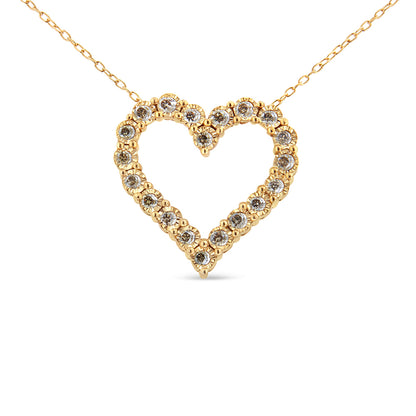 Front view of a yellow metal necklace with a heart-shaped pendant featuring round brownish gemstones in a miracle setting.
