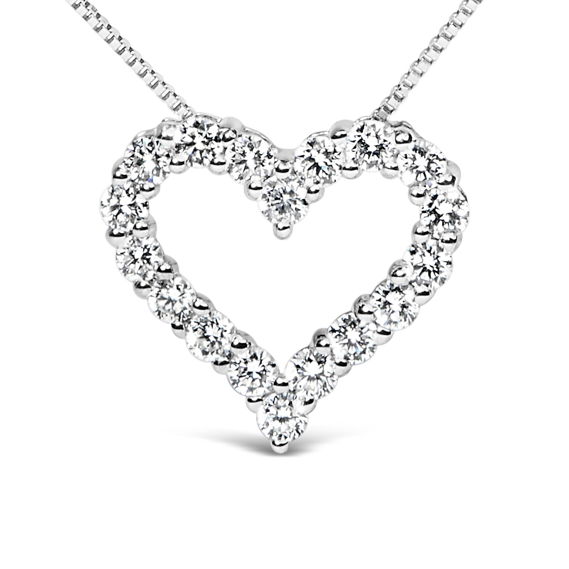 Front-facing close-up of a white metal heart-shaped necklace pendant set with round white gemstones in prong settings.
