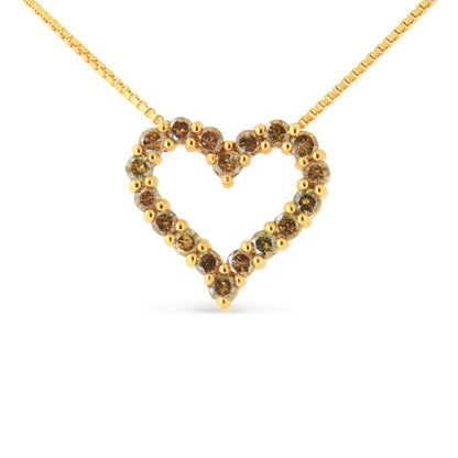 Yellow metal heart-shaped necklace pendant with round brownish gemstones in prong settings, front angle.