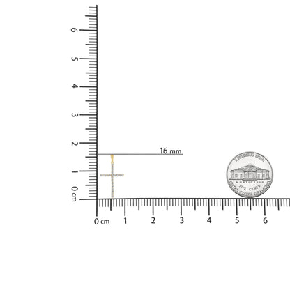 Close-up front view of a yellow metal cross-shaped necklace pendant with round brownish gemstones in prong settings, positioned on a ruler and scale for size reference.