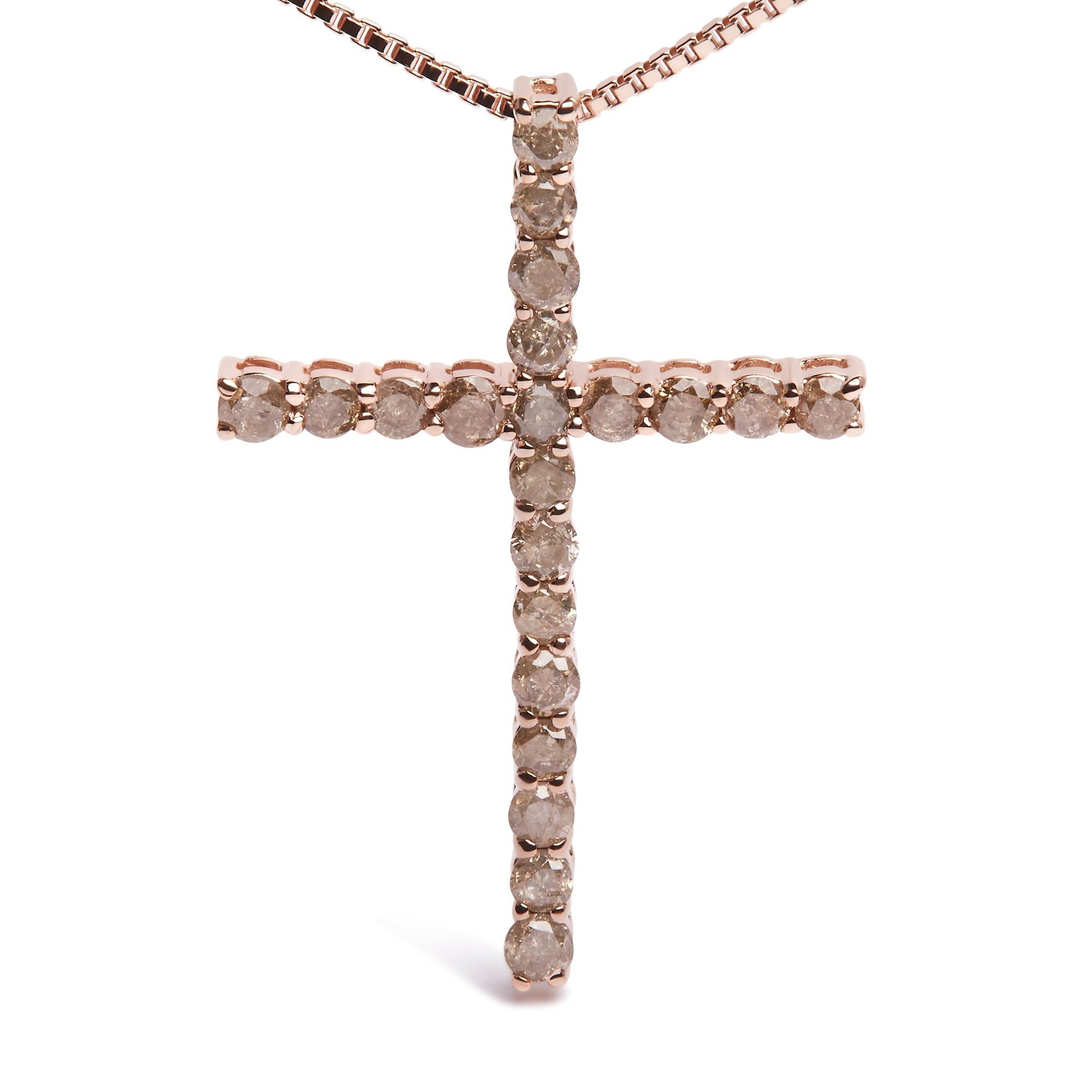 Front view of a rose metal cross necklace pendant with round champagne-colored gemstones in prong settings.