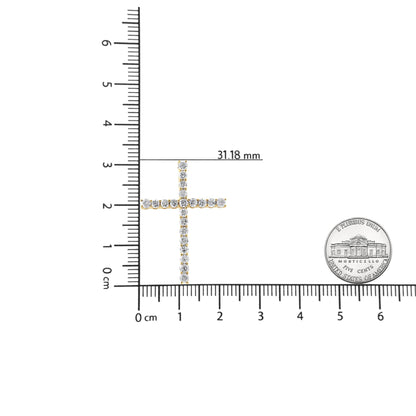 Top-down view of a yellow metal cross-shaped necklace pendant with round brownish prong-set gemstones, shown on a ruler and next to a coin for size reference.