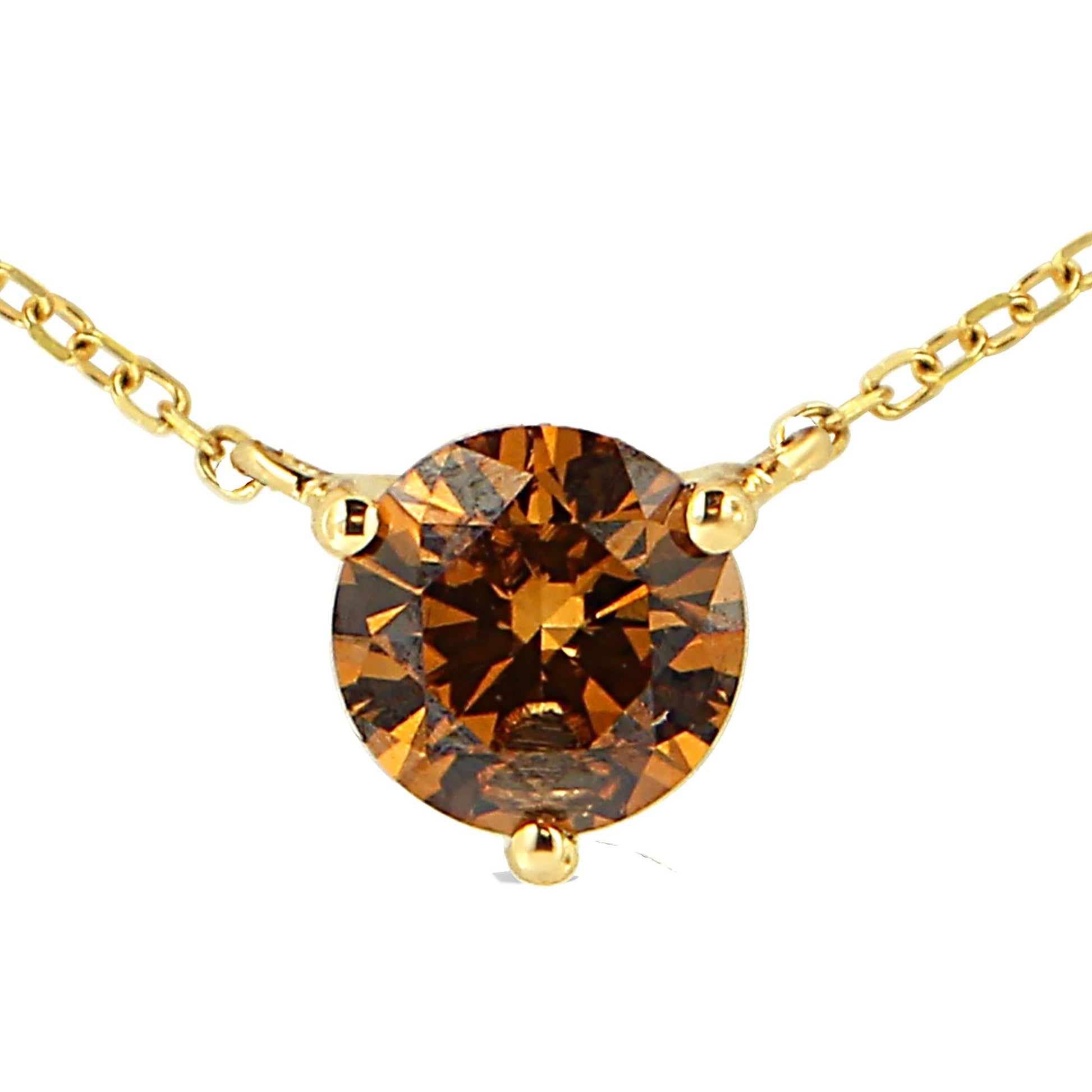 Close-up front angle of a yellow metal necklace with a round brown gemstone set in a 3-prong setting.
