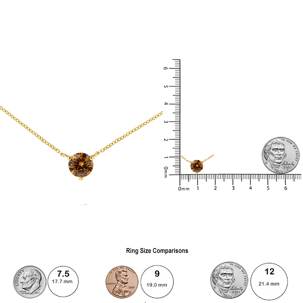 Front view of a yellow necklace with a round brown gemstone in a 3-prong setting; the necklace is also shown from a distance on a ruler and scale for size reference.
