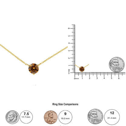 Front view of a yellow necklace with a round brown gemstone in a 3-prong setting; the necklace is also shown from a distance on a ruler and scale for size reference.