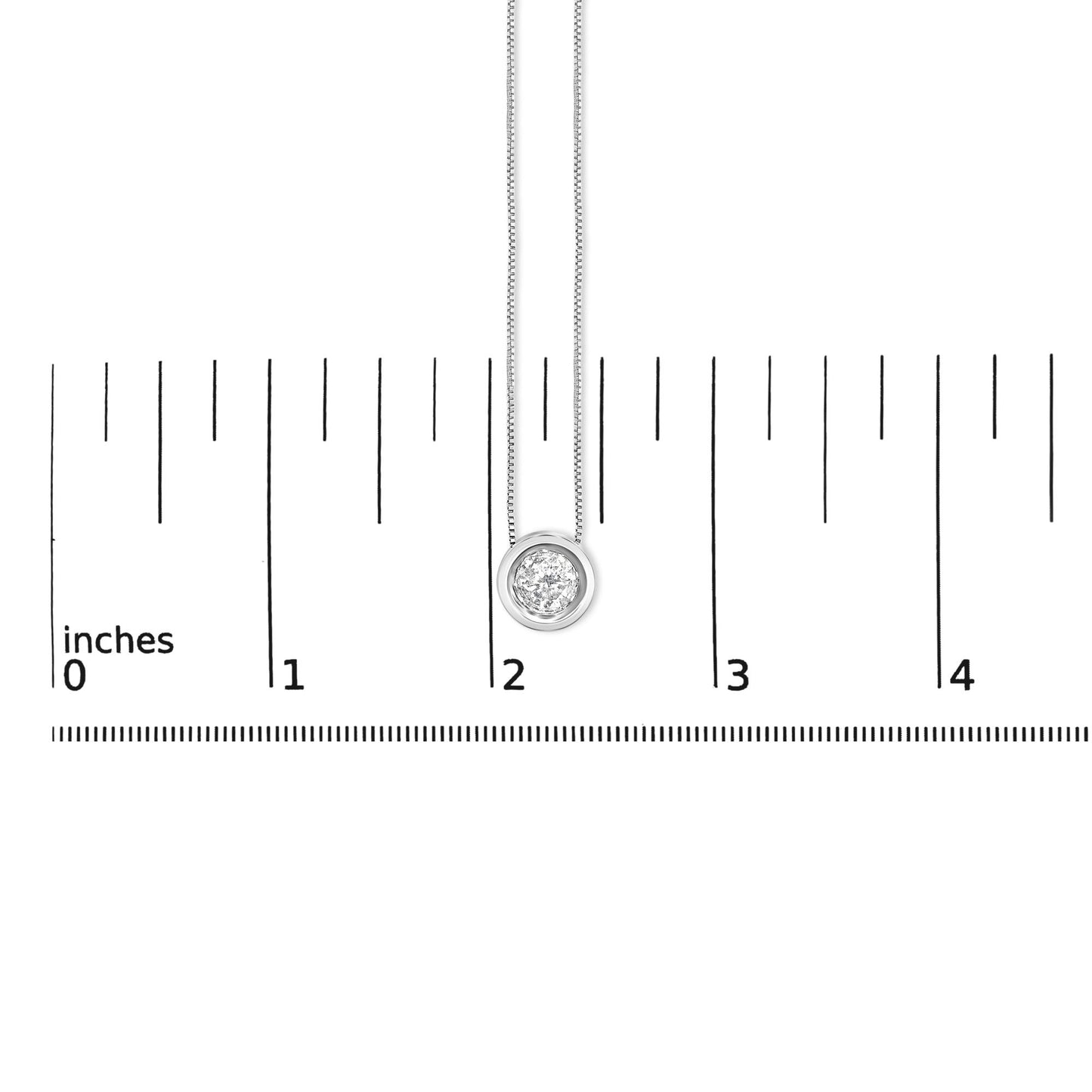 Close-up front view of a white metal necklace with a round bezel-set white gemstone pendant shown on a scale marked in inches.