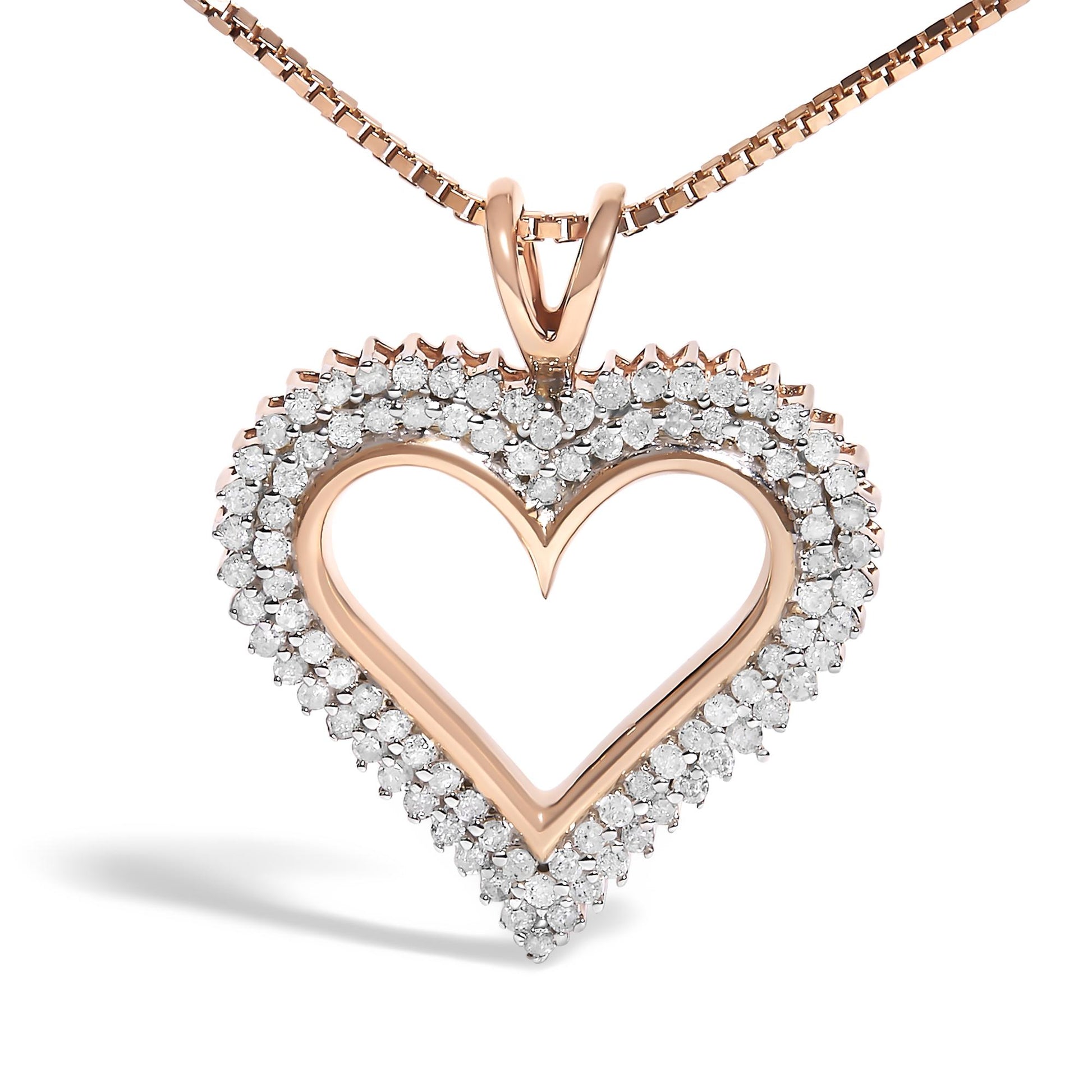 Close-up front view of a rose-colored metal heart-shaped necklace pendant adorned with two rows of round white gemstones in prong settings.