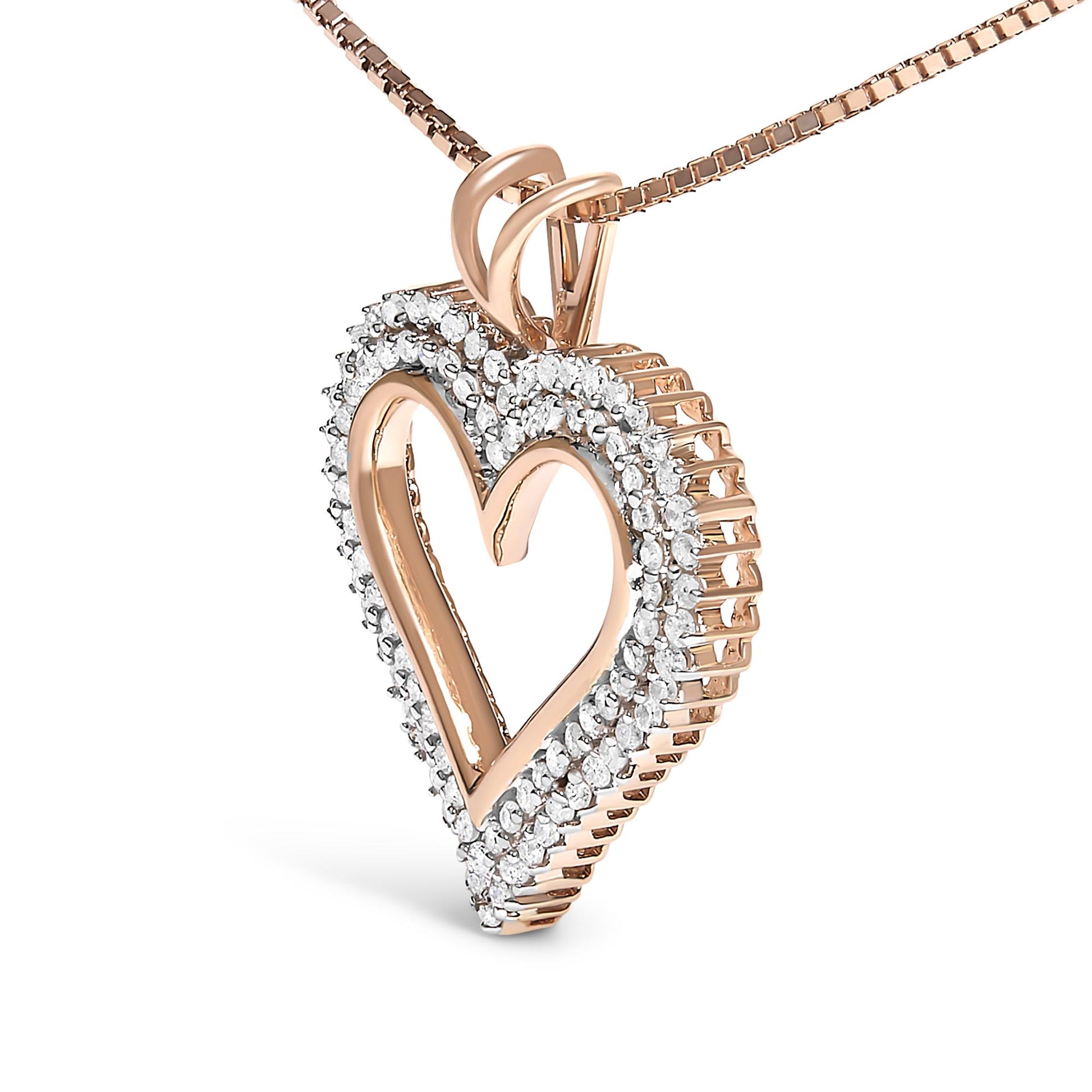 Close-up angled view of a rose metal heart-shaped necklace pendant with two rows of white round prong-set gemstones around the edges.