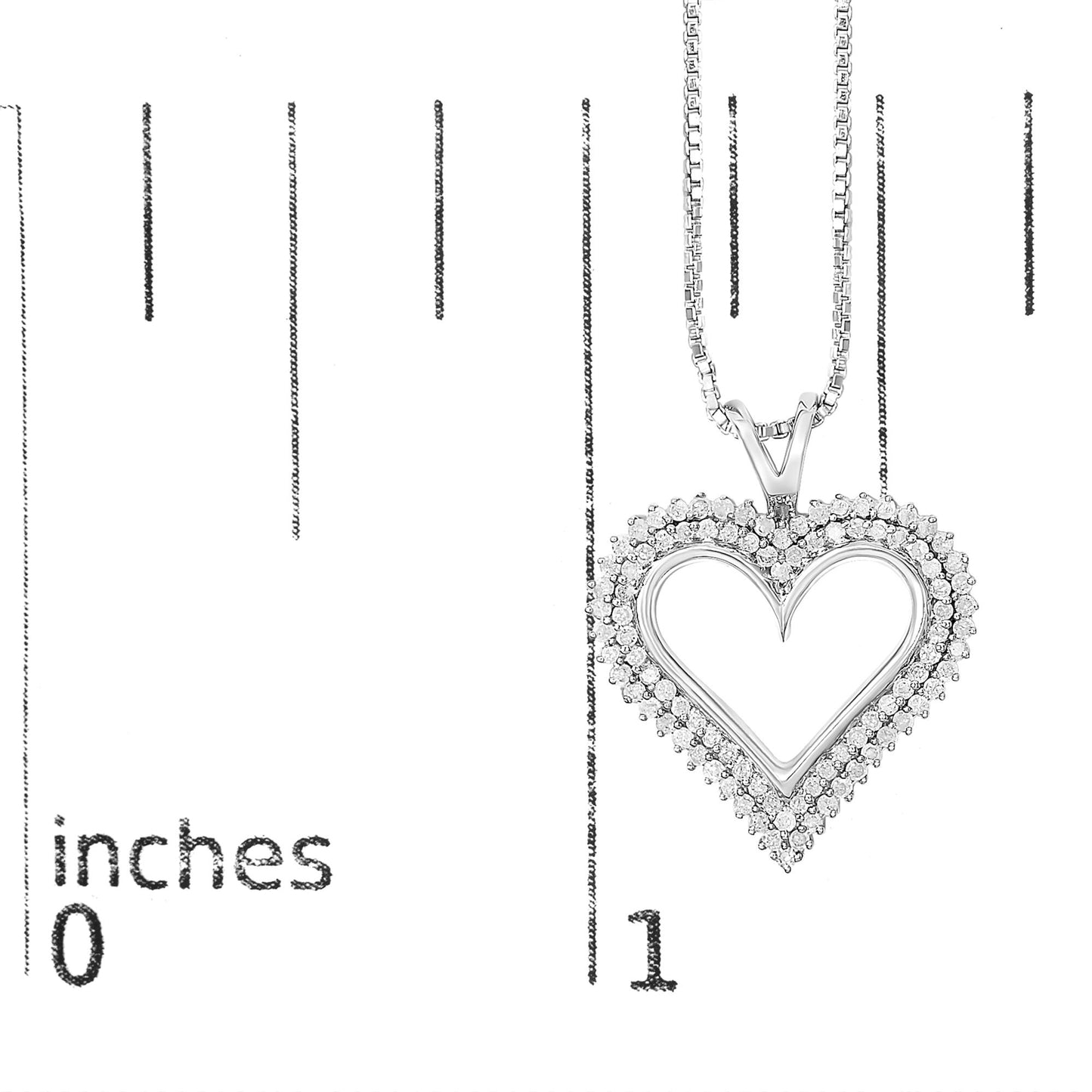 Front view of white metal heart-shaped necklace pendant with two rows of round white gemstones in prong setting, shown on a ruler for size reference.