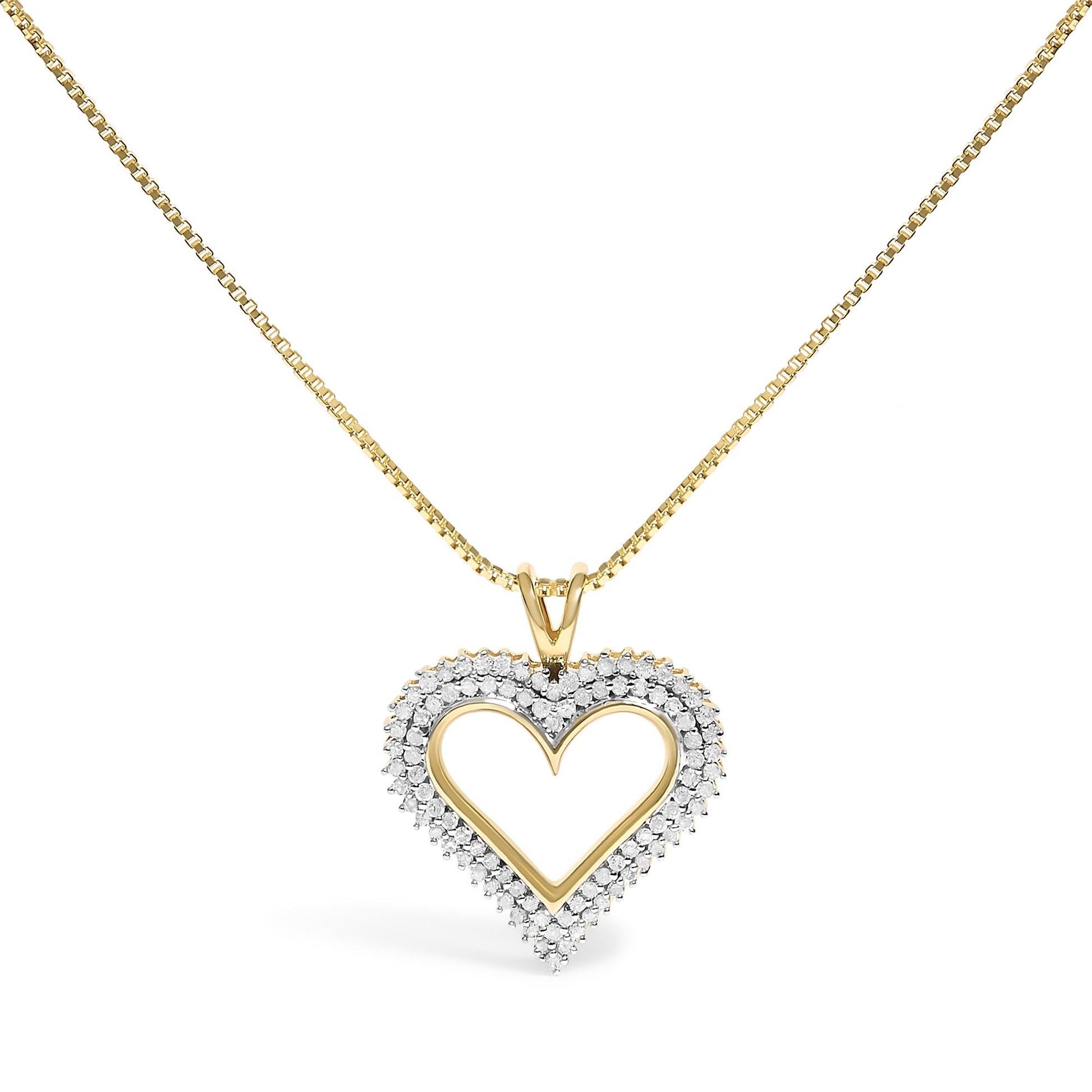Front view of a yellow metal heart-shaped pendant necklace with white round gemstones set along the heart outline.