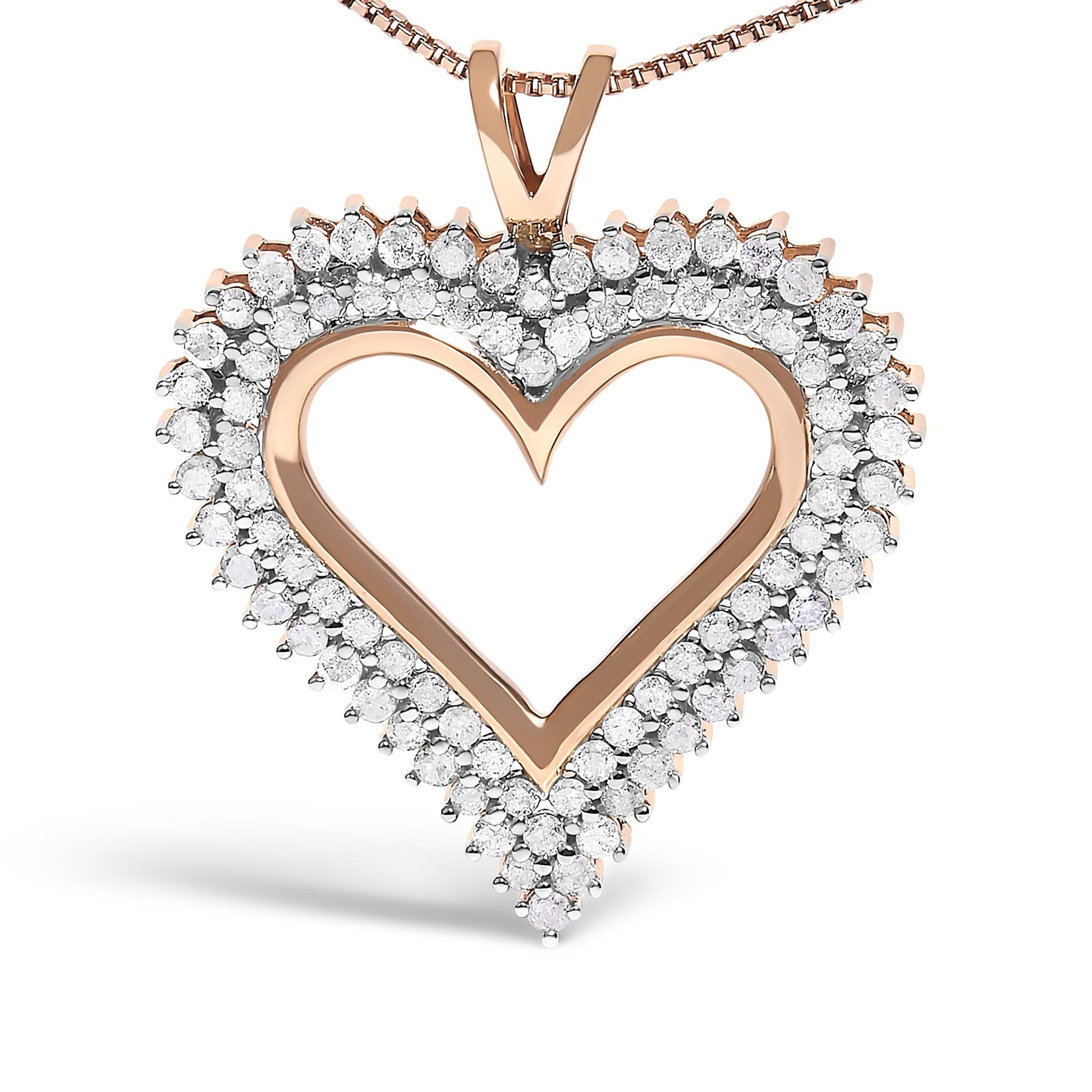 Close-up front angle of a rose-colored metal heart-shaped necklace pendant with an open center, bordered by prong-set round white gemstones.
