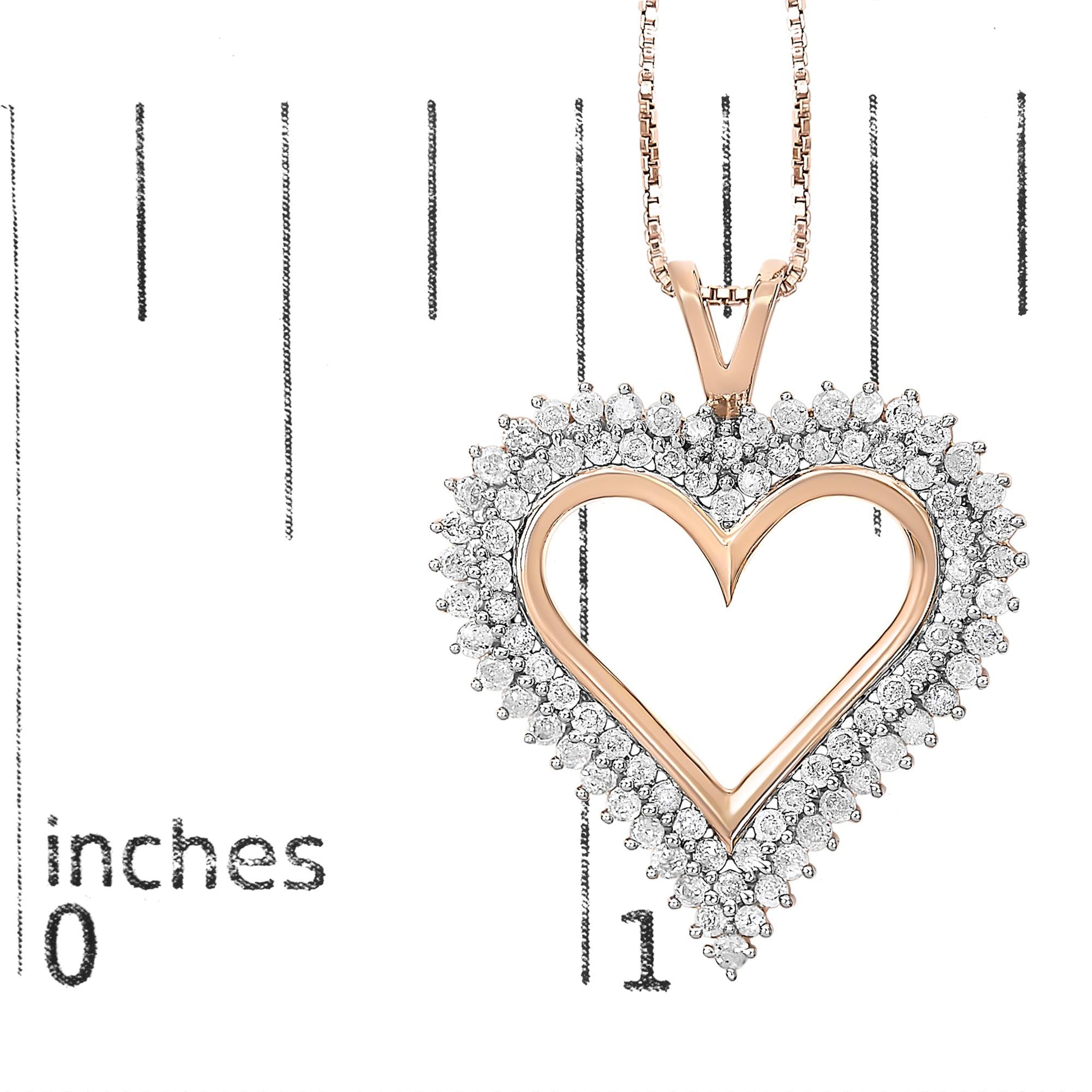Close-up front view of a rose-colored heart-shaped necklace pendant with round white gemstones in prong settings surrounding the heart, placed on a ruler for size reference.