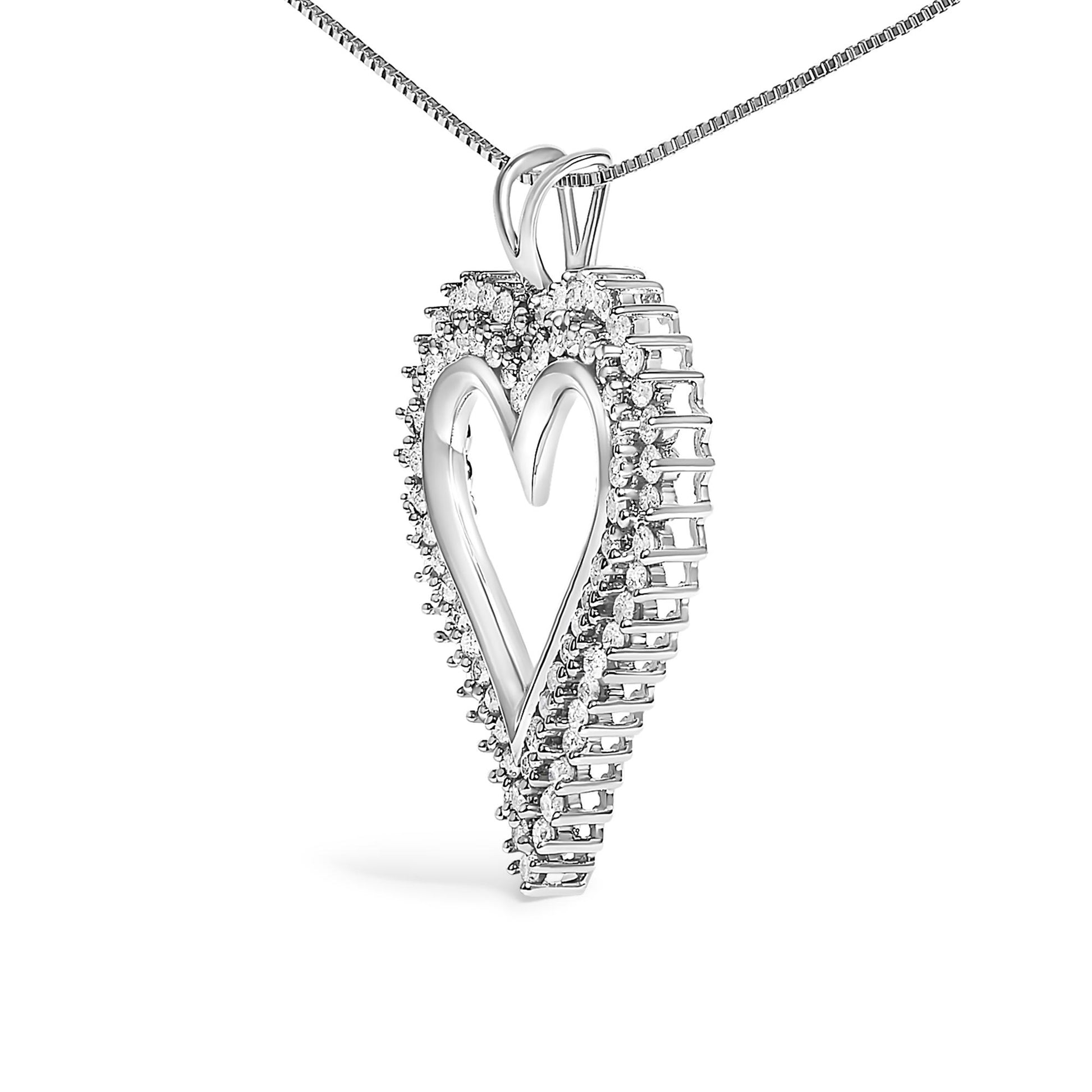 Close-up angled view of a white metal heart-shaped pendant necklace featuring round white gemstones in prong settings surrounding the edges.