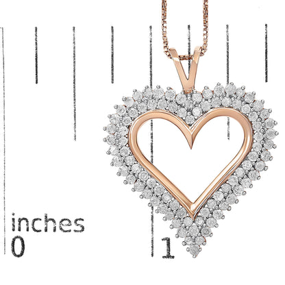 Close-up front view of a rose-colored heart-shaped necklace pendant surrounded by two rows of prong-set round white gemstones, placed on a ruler for size reference.