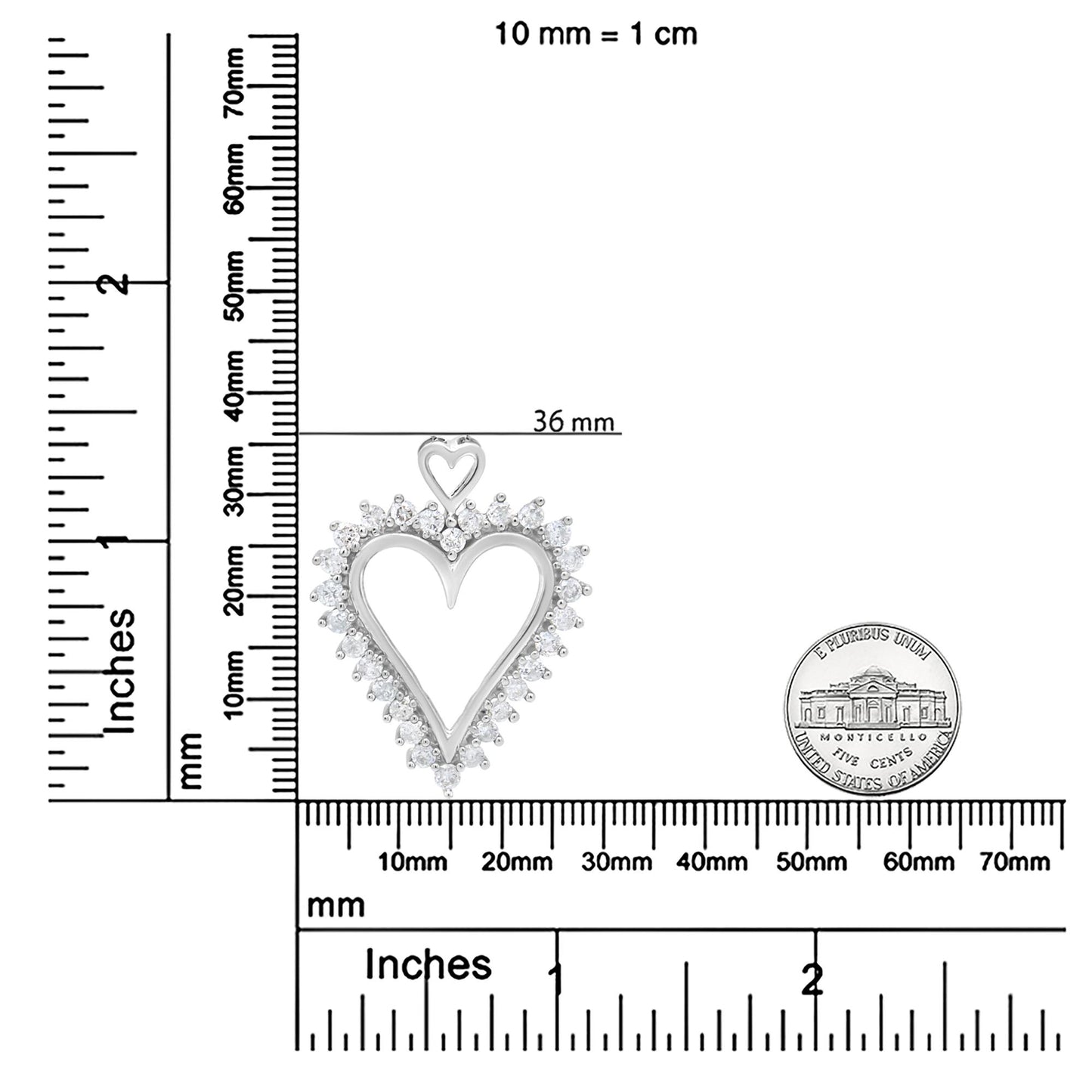 Top-down view of a white metal heart-shaped necklace pendant with a smaller heart at the top, surrounded by round white gemstones in prong settings, placed on a ruler for size reference.