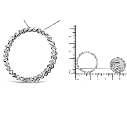 Front angled view of a white necklace with a circular design featuring round white gemstones in prong settings, shown next to a ruler and a coin for size reference.