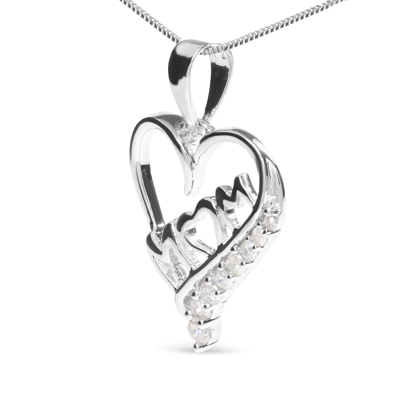 Close-up front angle of a white metal heart-shaped necklace pendant with the word 'Mom' inside, featuring small round white gemstones in prong settings decorating part of the heart.