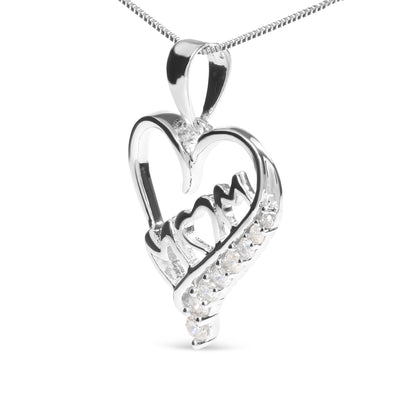 Close-up front angle of a white metal heart-shaped necklace pendant with the word 'Mom' inside, featuring small round white gemstones in prong settings decorating part of the heart.