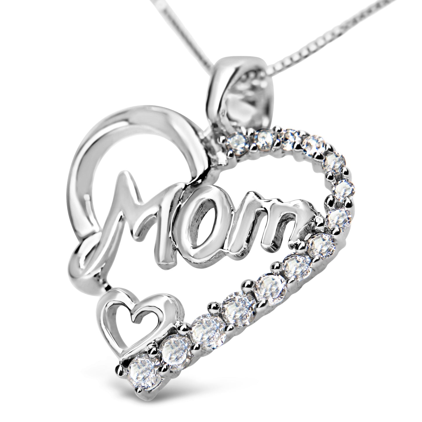 Close-up angled view of a white metal necklace pendant shaped like a heart with the word 'Mom' in script inside, accented with prong-set round white gemstones along one side and a small heart near the bottom.