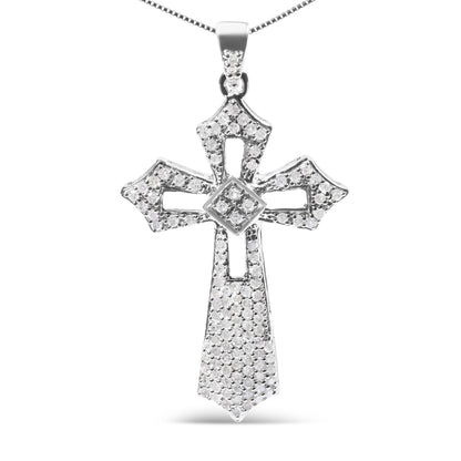 Front-facing shot of a white metal cross-shaped necklace pendant adorned with multiple round white gemstones in prong settings.