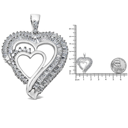 White metal heart-shaped necklace pendant with overlapping heart outlines, adorned with round prong-set white gemstones and baguette channel-set white gemstones, shown at a front angle next to a ruler and coin for size reference.