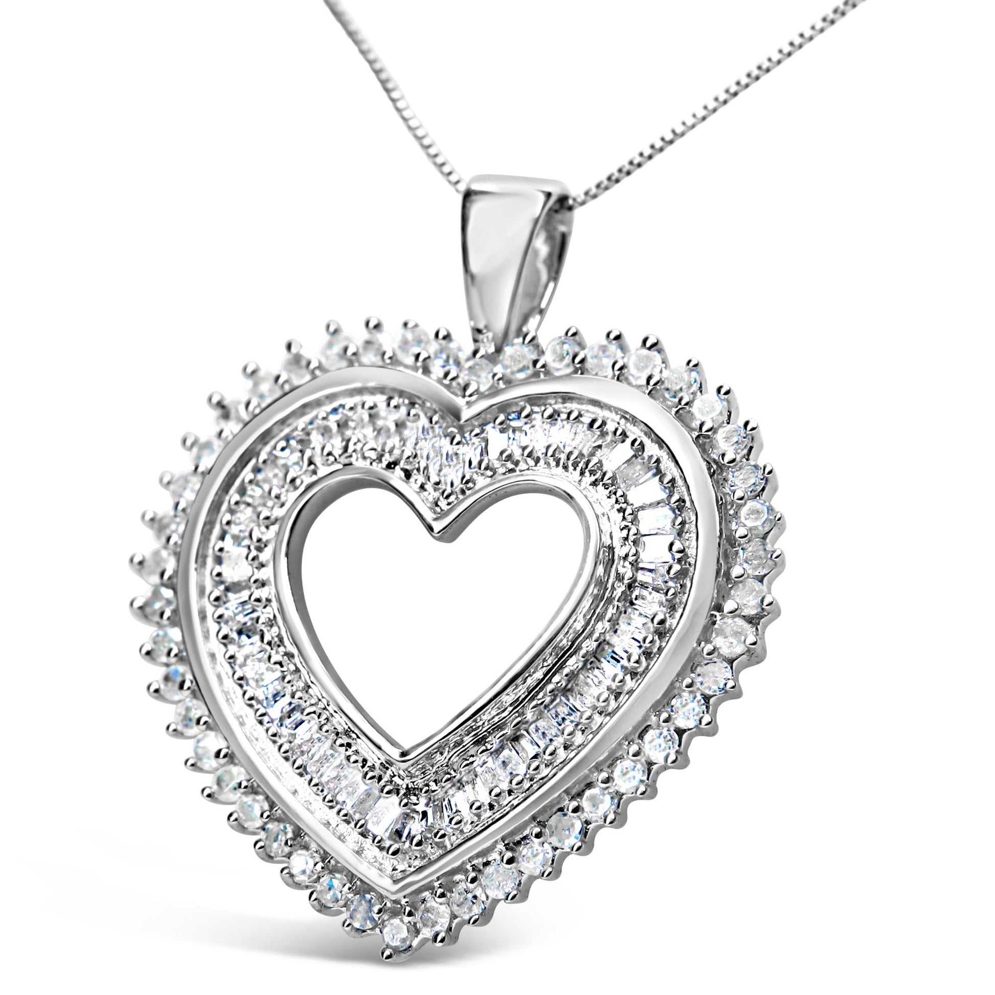 Close-up front angle of a white metal heart-shaped necklace pendant with two rows of white round prong-set gemstones surrounding a row of white baguette channel-set gemstones in the center.
