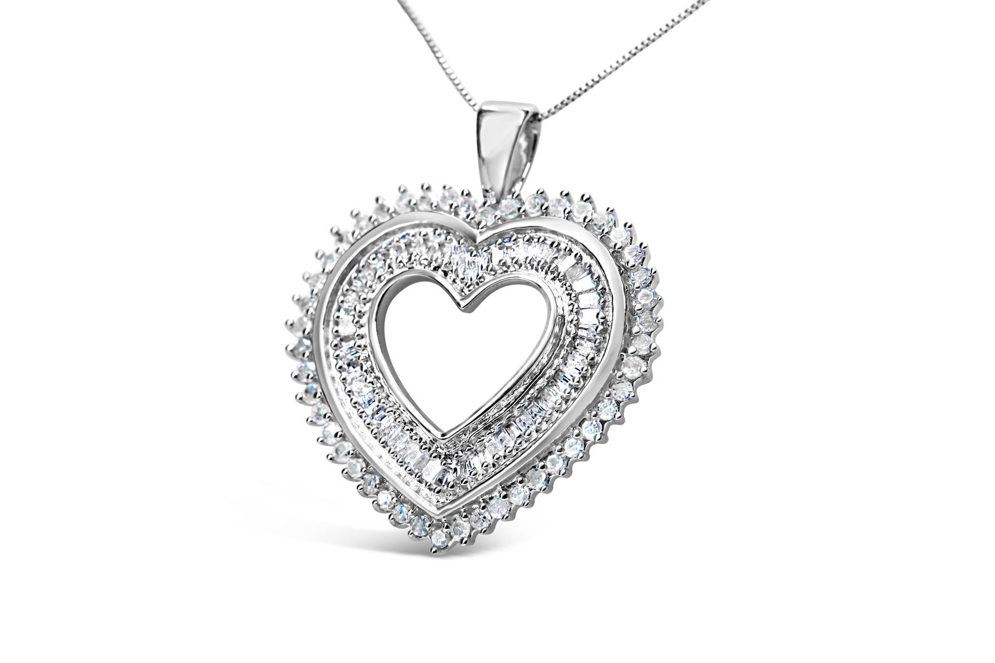 Close-up front angle of a white metal heart-shaped necklace pendant with round prong-set white gemstones on the outer edge and baguette channel-set white gemstones on the inner part of the heart, suspended on a chain.