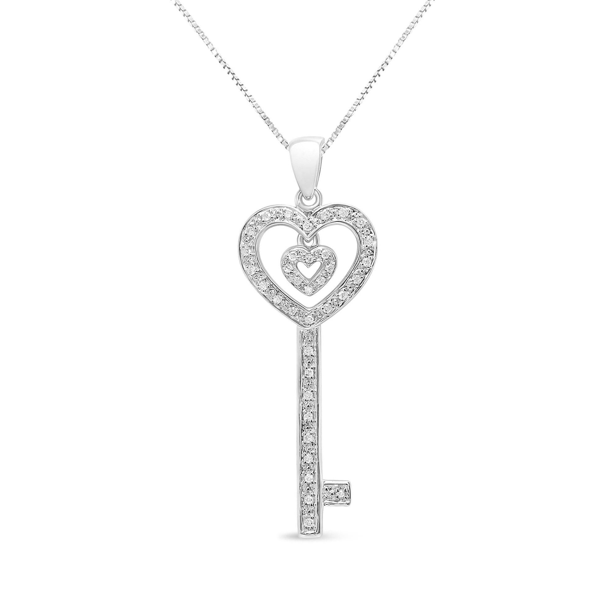 Front view of a white necklace with a key-shaped pendant featuring two heart-shaped loops and round white gemstones in prong settings.
