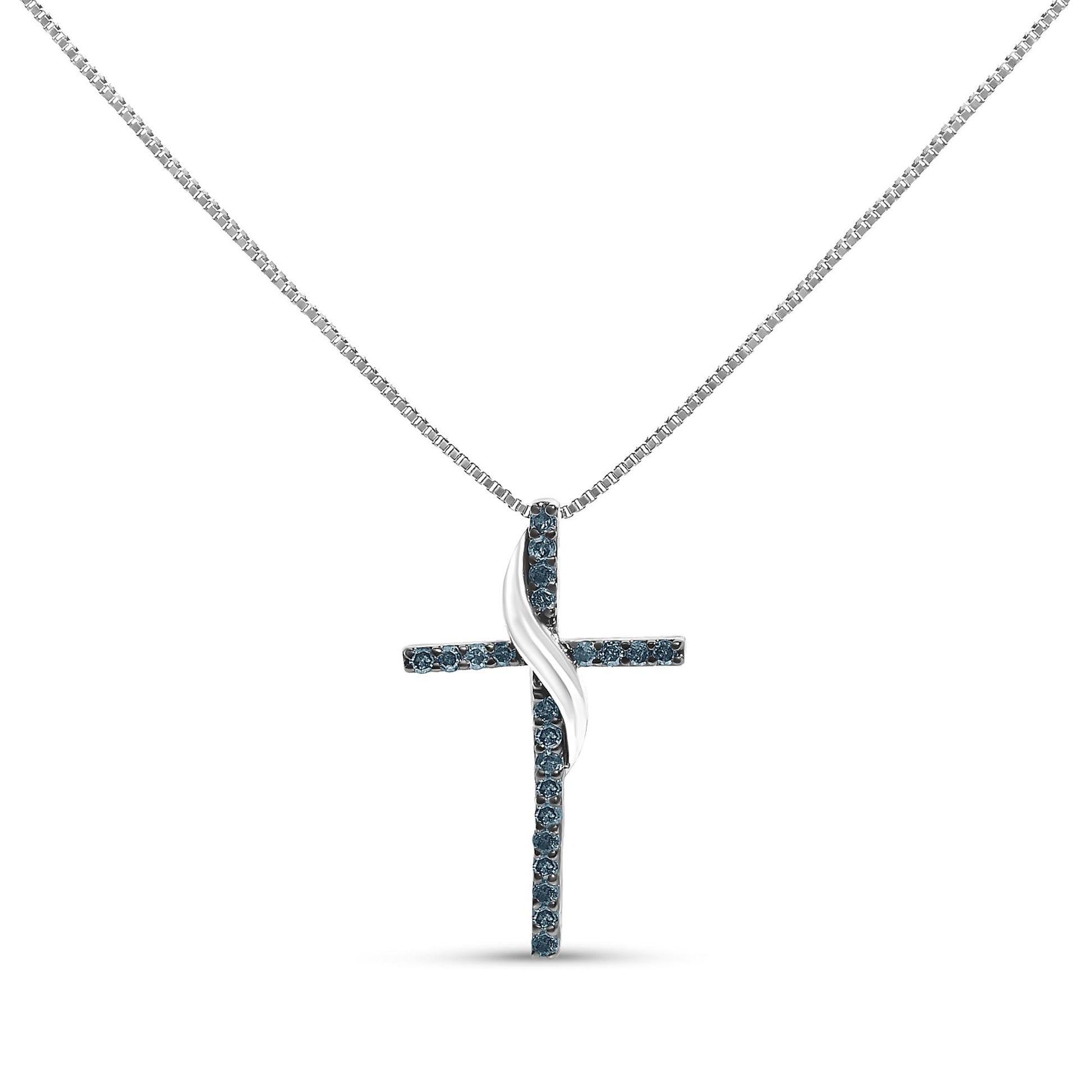 Front-facing shot of a white necklace with a cross pendant featuring round blue gemstones in prong settings and a twisted metal accent in the center.