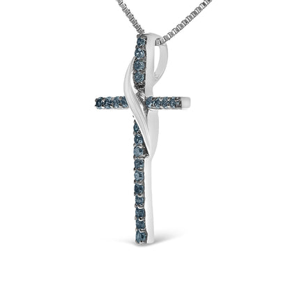 Front angled view of a white metal cross-shaped necklace pendant adorned with round prong-set blue gemstones, suspended on a matching chain.