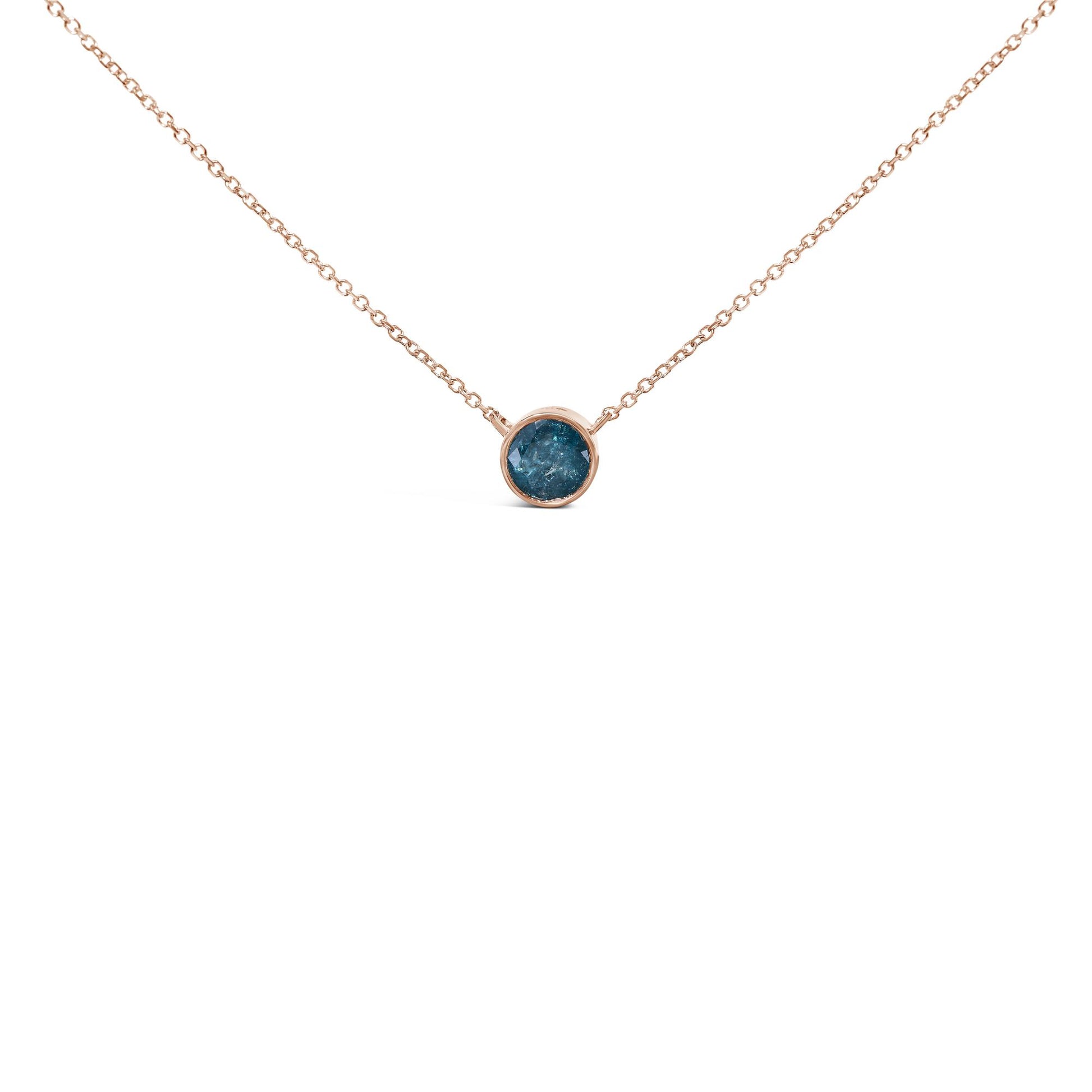 Close-up front view of a rose-colored necklace with a round blue gemstone set in a bezel setting, shown on a white background.