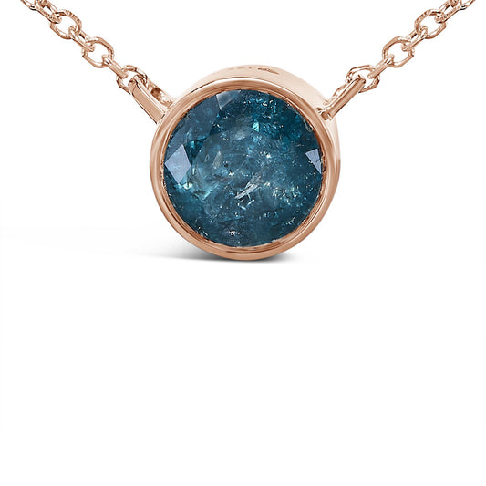 Close-up front view of a rose metal necklace with a round blue gemstone in a bezel setting.