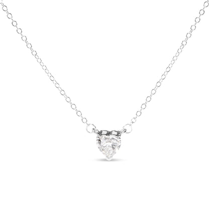 Front view of a white metal necklace with a heart-shaped white gemstone in a three-prong setting.