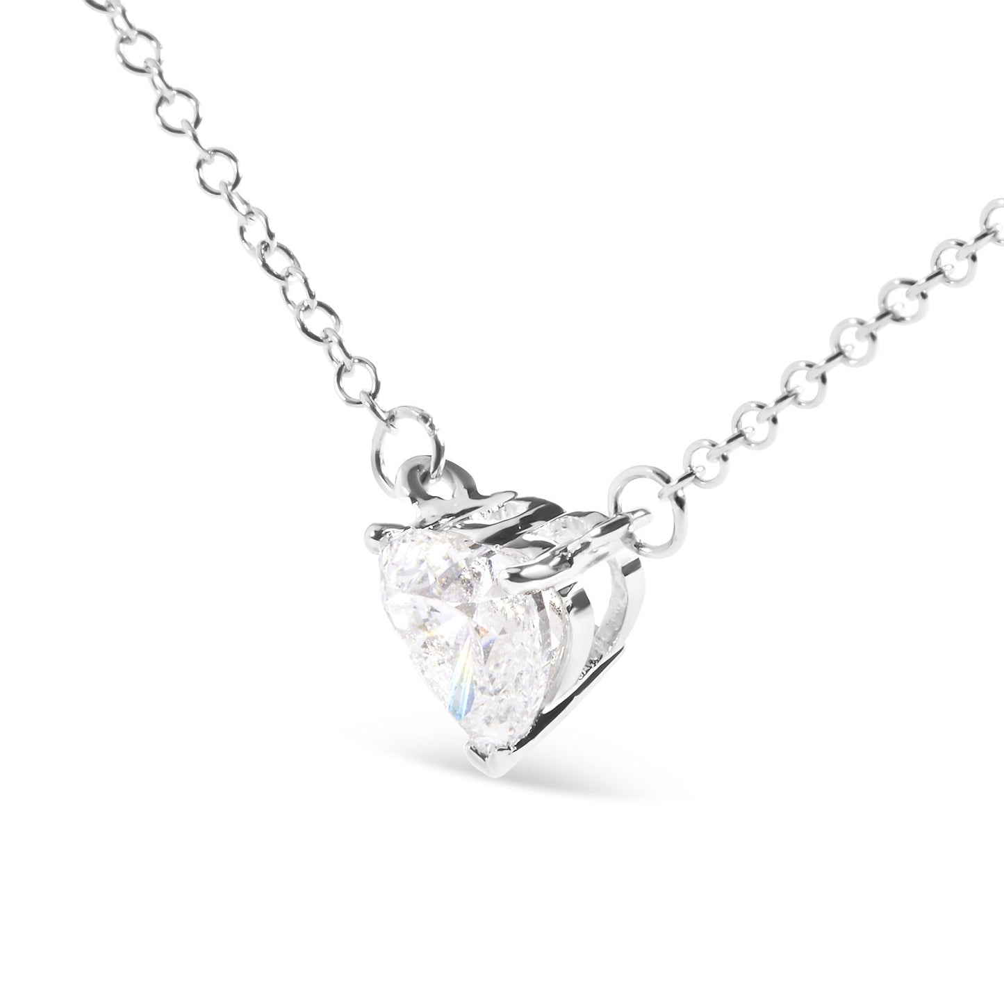 Close-up front angled view of a white metal necklace with a heart-shaped white gemstone in a 3-prong setting.