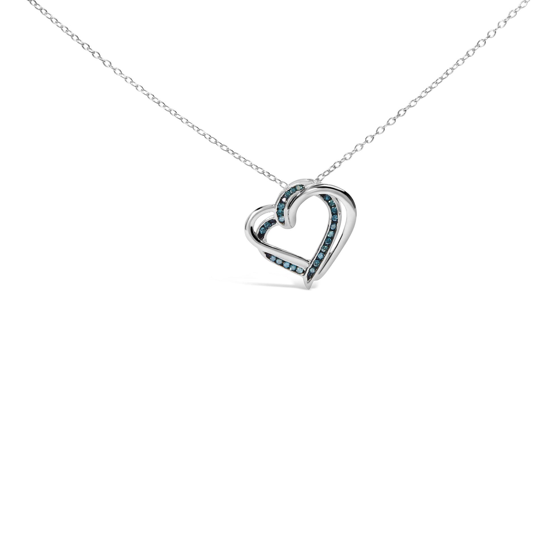 White metal heart-shaped necklace pendant with round blue gemstones in channel setting, shown in a front angle.
