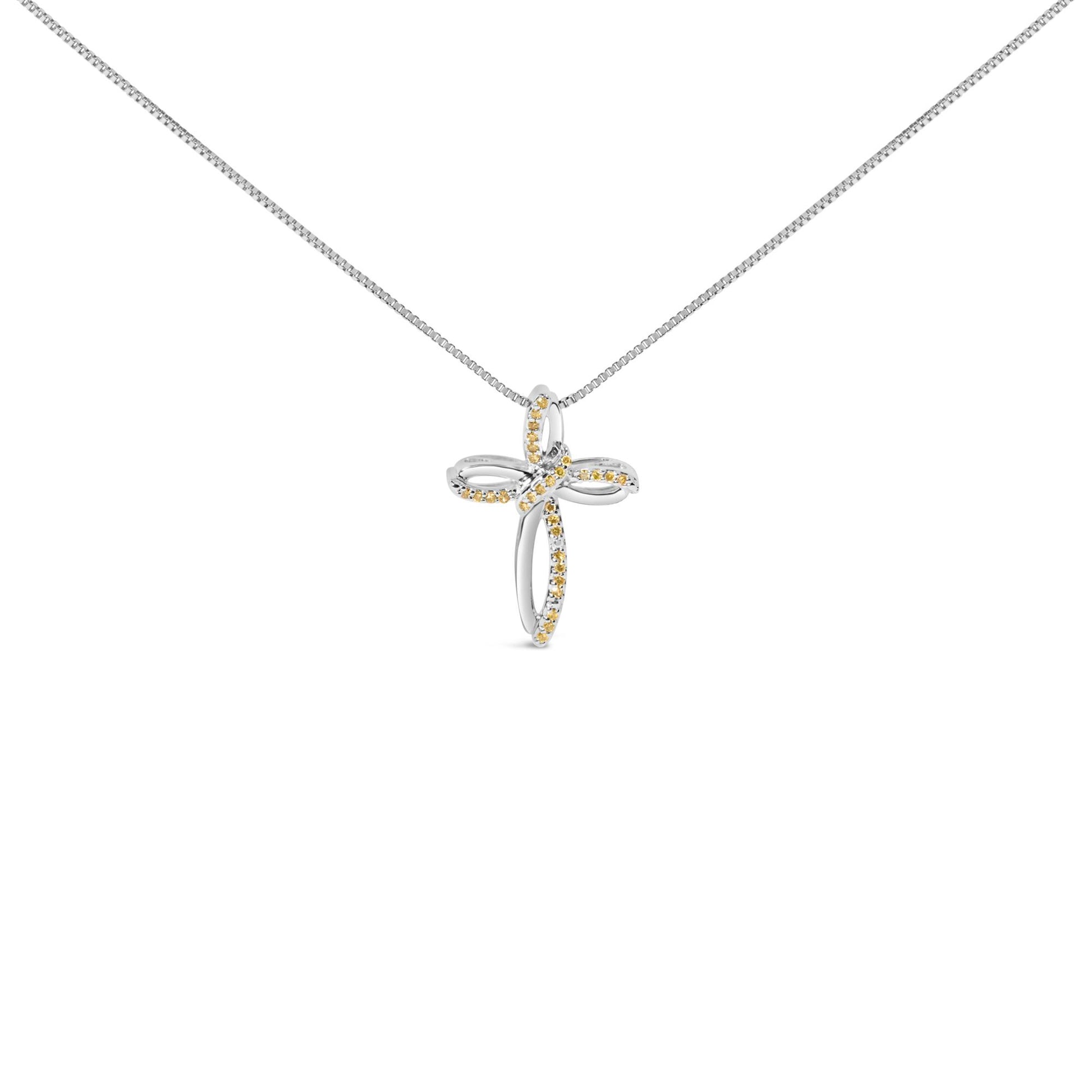 White necklace with cross-shaped pendant featuring yellow round gemstones in prong settings, shown from the front.