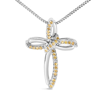 Front view of a white metal cross-shaped necklace pendant adorned with round yellow gemstones in prong settings along the loops, hanging from a box chain.