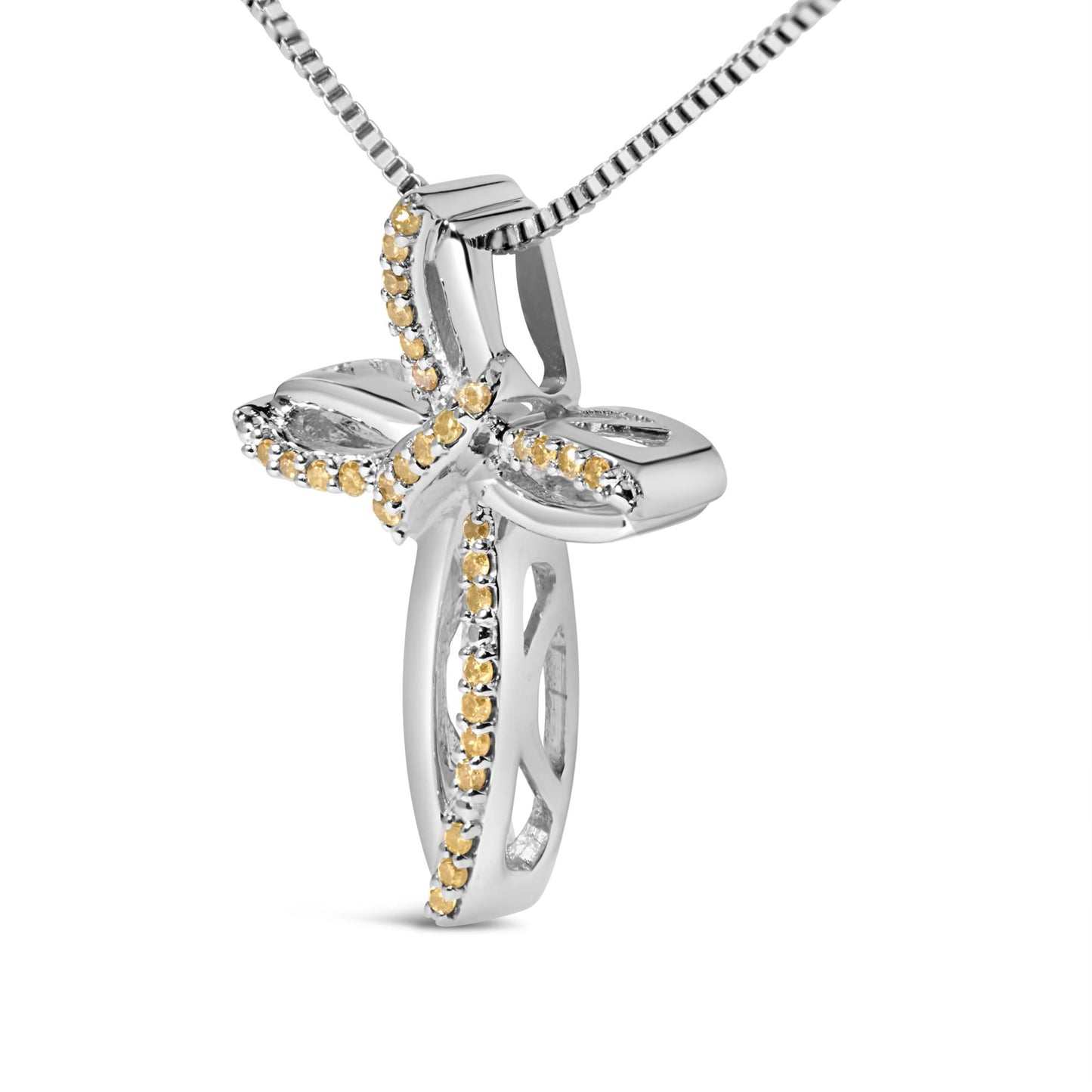 Close-up front angle of a white metal necklace pendant shaped like a cross, adorned with small round yellow gemstones in prong settings along its edges.