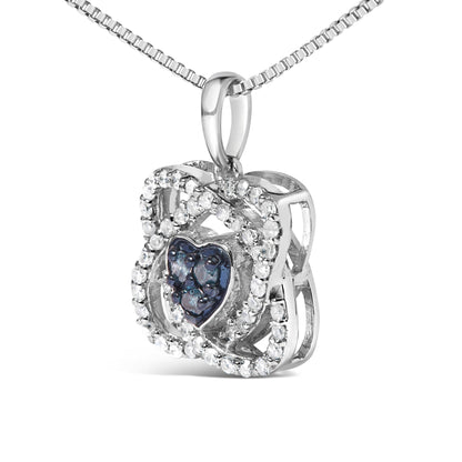 Close-up front angle of a white metal necklace pendant featuring a heart-shaped blue gemstone center, surrounded by a double layered square frame decorated with white gemstones.