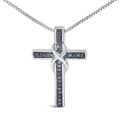 Front-facing shot of a white metal cross necklace pendant with blue round gemstones in prong settings arranged along the arms, featuring a twisted design where the vertical and horizontal bars intersect.