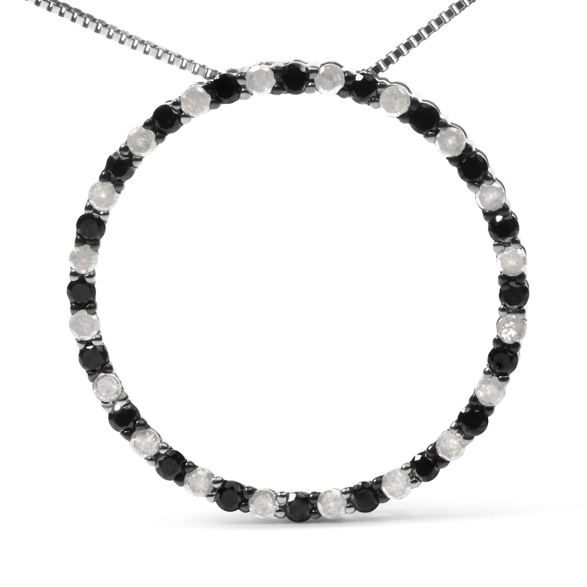 Front view of a white necklace with alternating round black and white gemstones in prong settings forming a circular pendant.