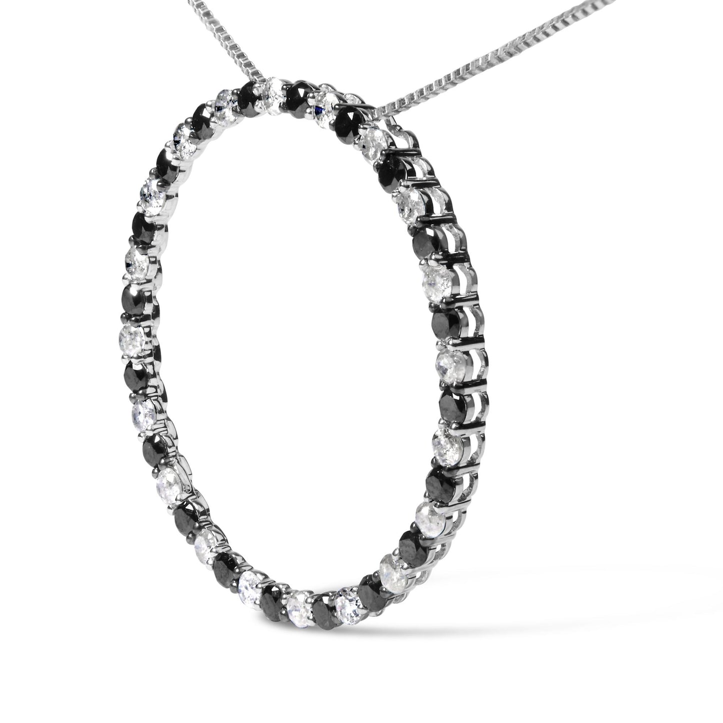 Close-up front angle of a white metal oval necklace pendant set with alternating round white and black gemstones in prong settings.