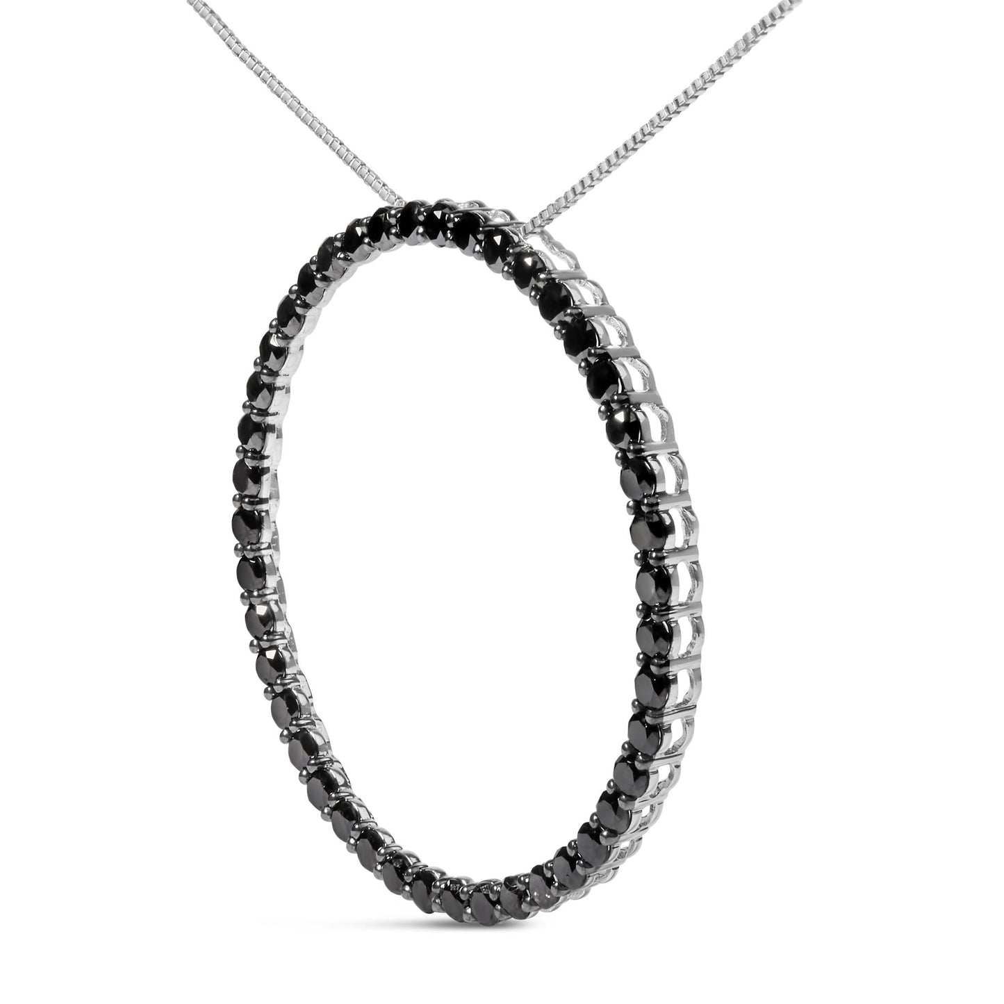 Close-up front angle of a white metal circular necklace pendant set with round black gemstones in a shared prong setting.