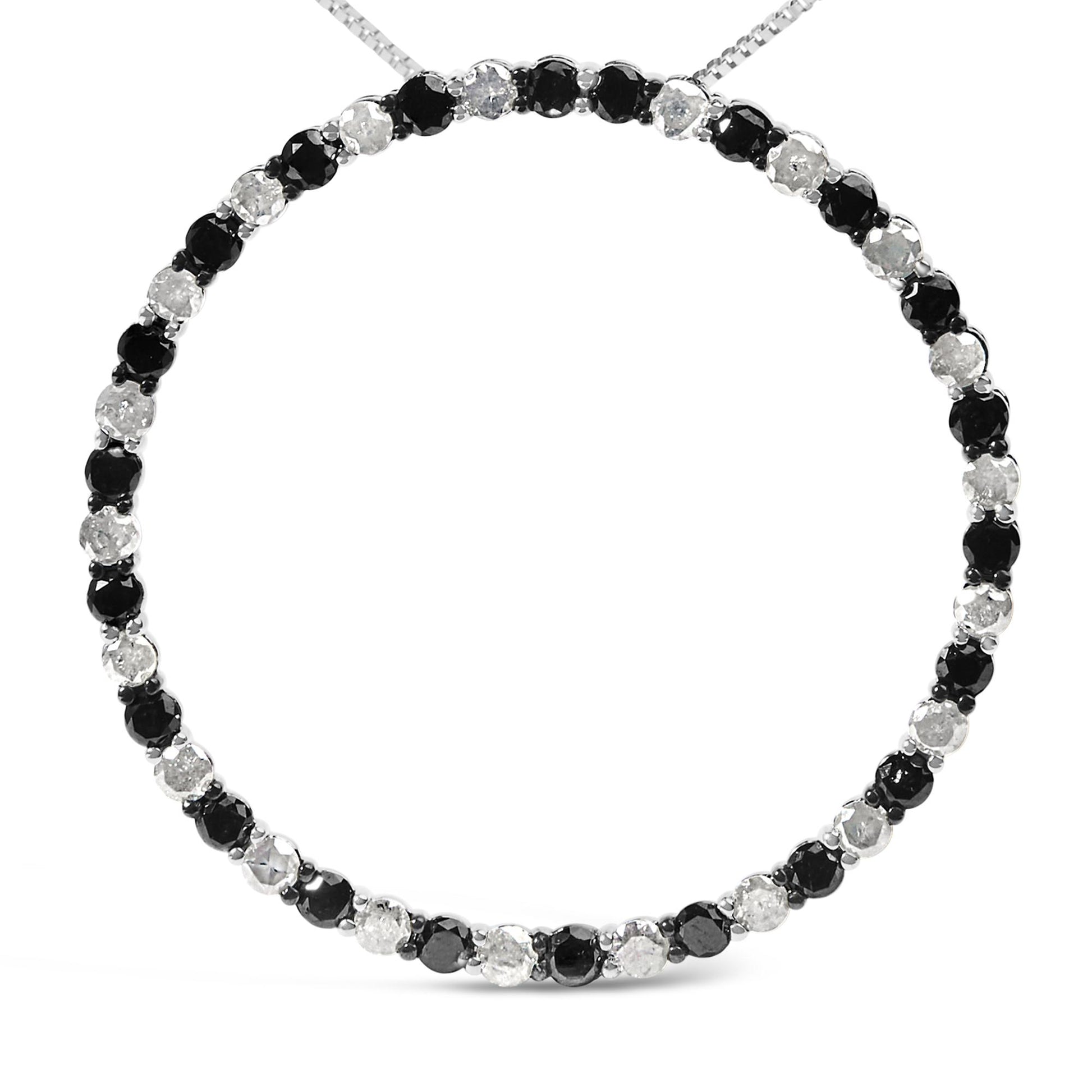 Front-facing close-up of a white metal necklace featuring alternating round black and white gemstones in prong settings.