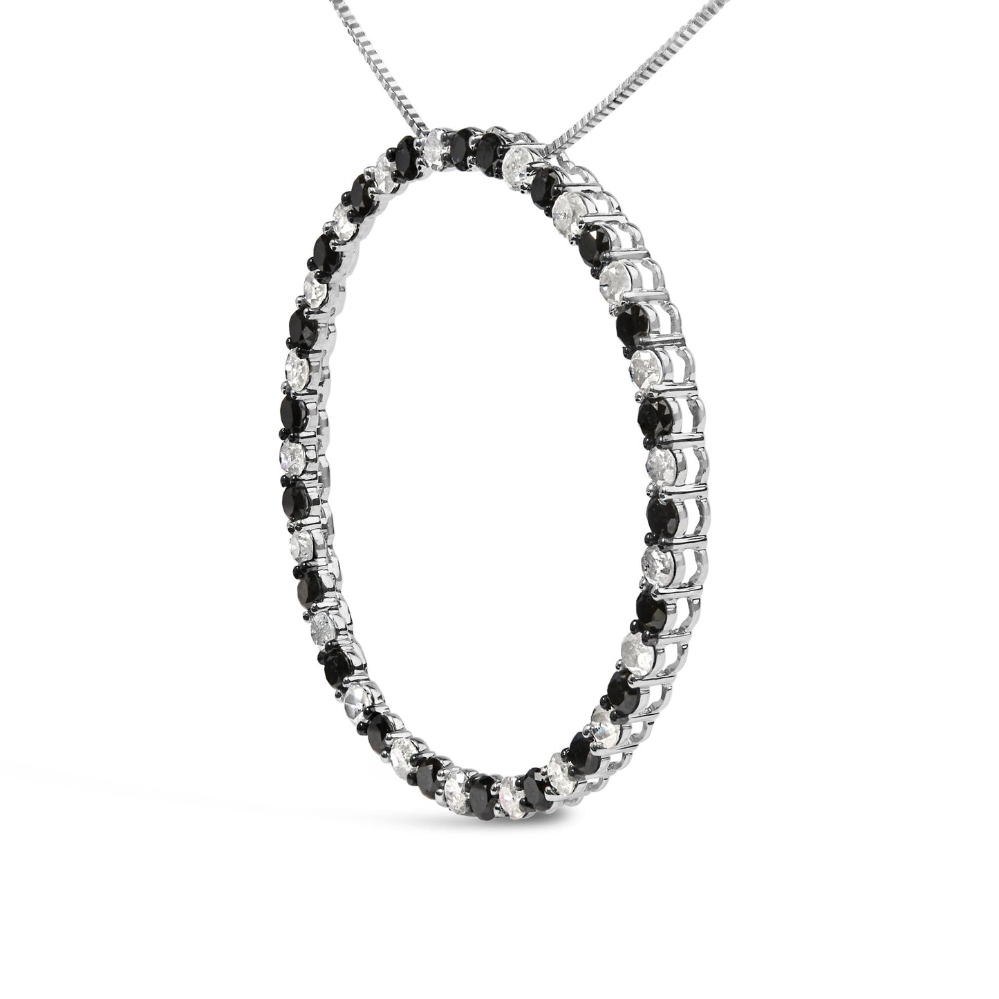 White metal necklace in a circular pendant shape set with alternating black and white round gemstones in prong settings, shown in a close-up angled shot.