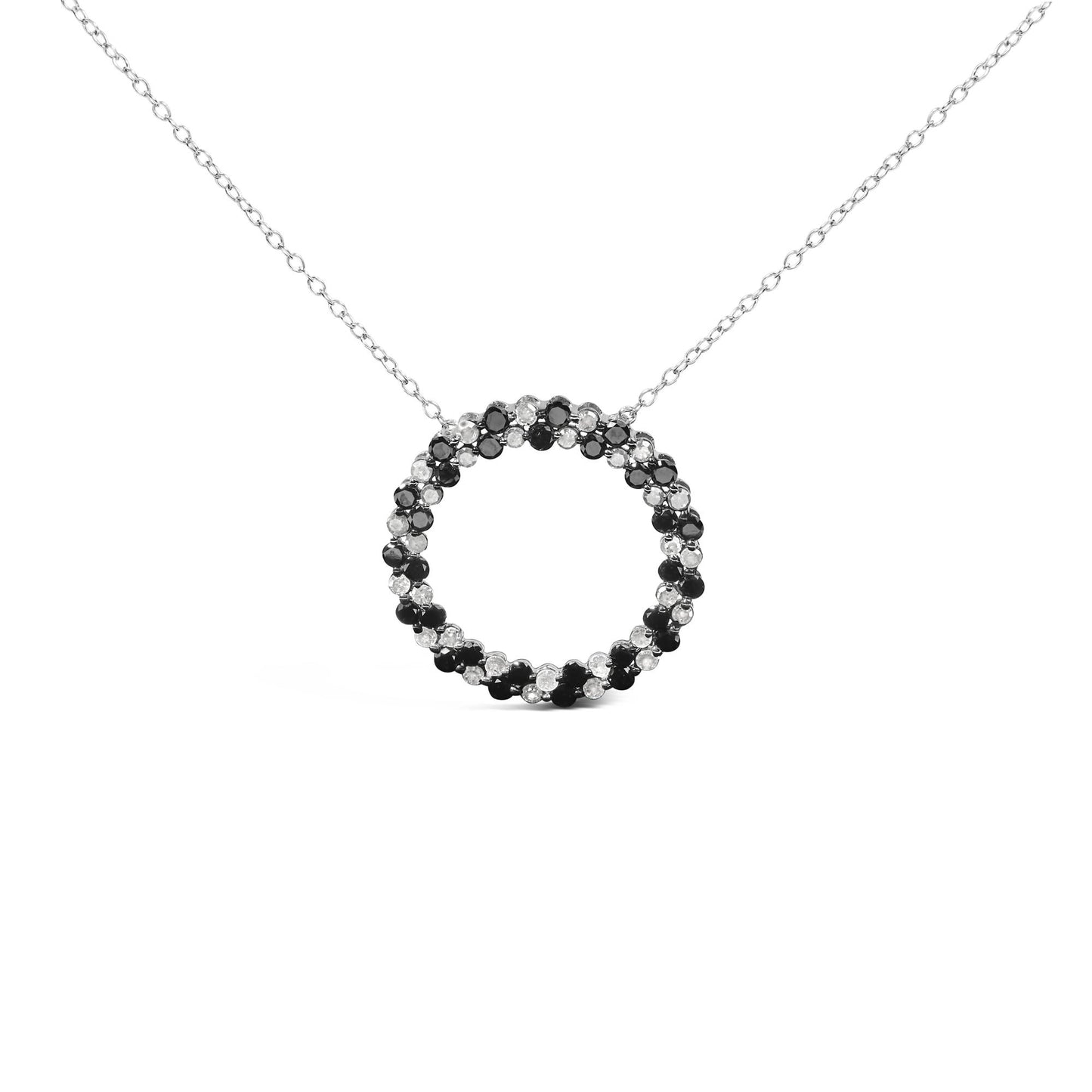 White metal necklace with circular pendant featuring alternating black and white round gemstones in prong settings, shown in a front-facing view.