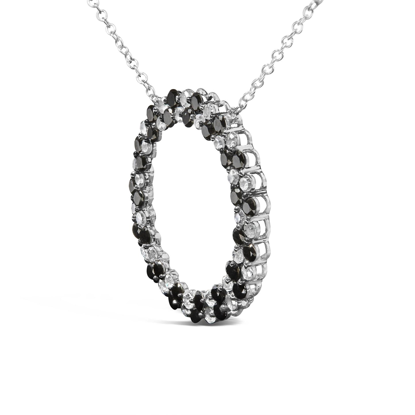 White necklace with a circular pendant featuring alternating black and white round gemstones in prong settings, shown at a slight angle.