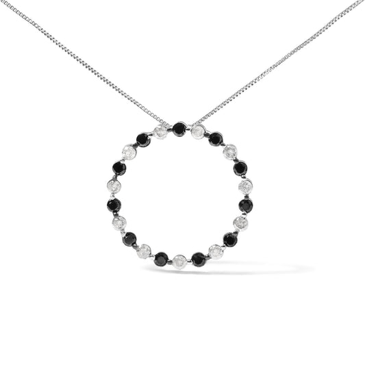 White metal necklace with a circular pendant featuring alternating round black and white gemstones in prong settings, shown from a front angle on a white background.