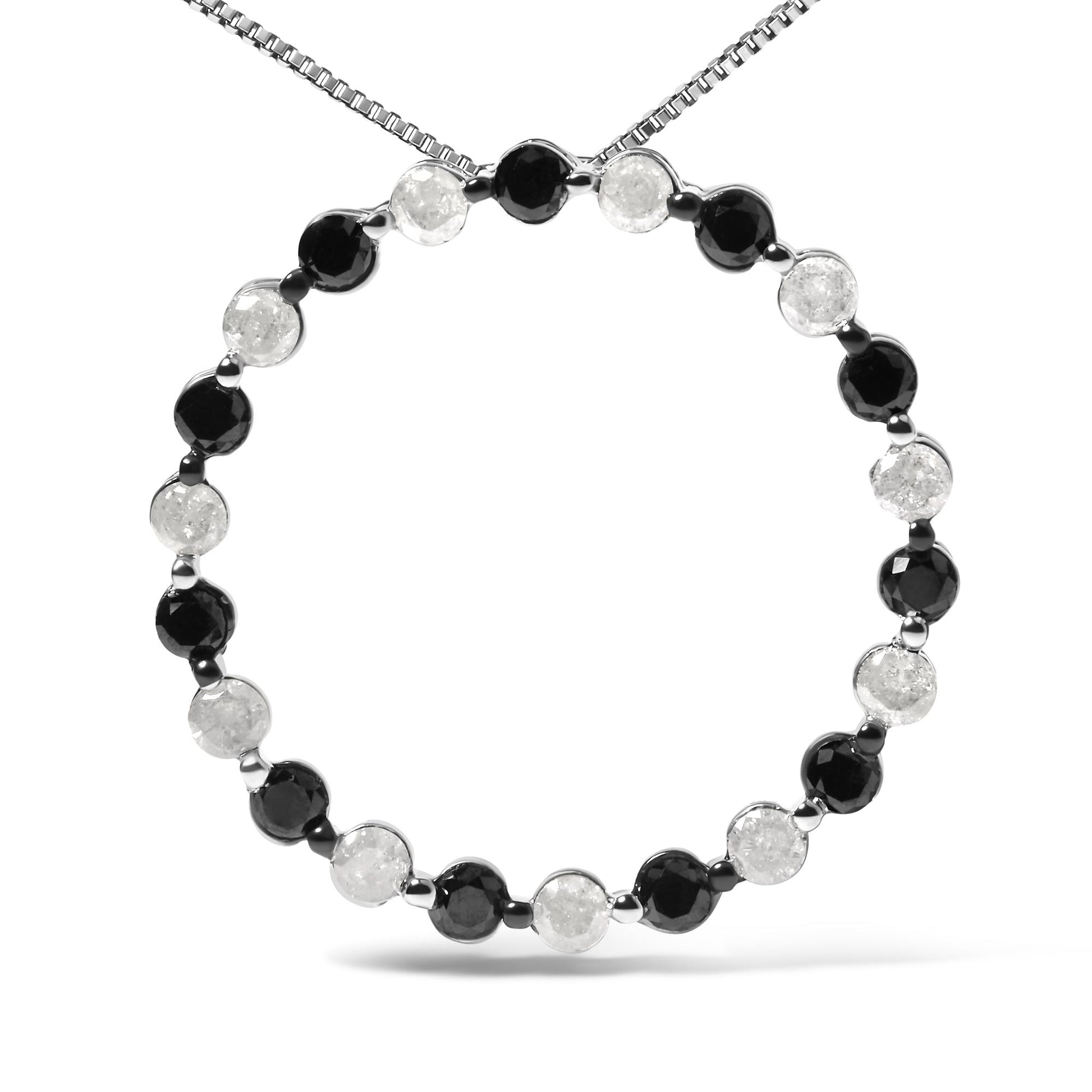 Front-facing shot of a white metal necklace with alternating round black and white gemstones in prong settings forming a circle.